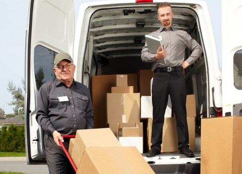 Man and van team loading furniture for a move in Hampstead