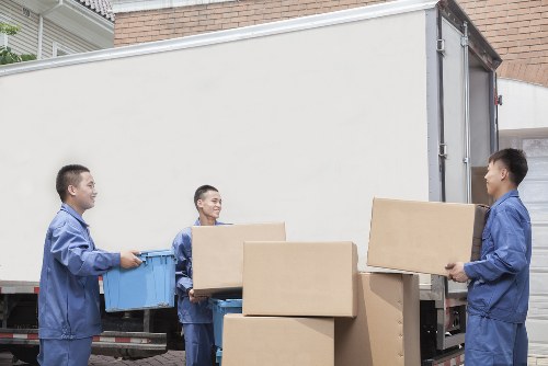 Removal team planning a move in a Hampstead residential street