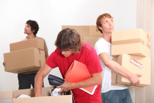 Removal team handling a Hampstead townhouse move on a local residential street