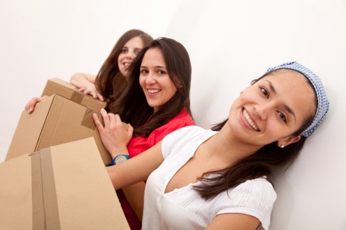 Professional movers handling household belongings during a local relocation