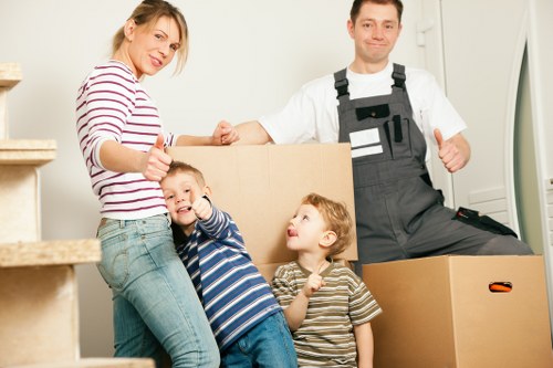 Packed moving boxes and furniture prepared for a home removal in Hampstead